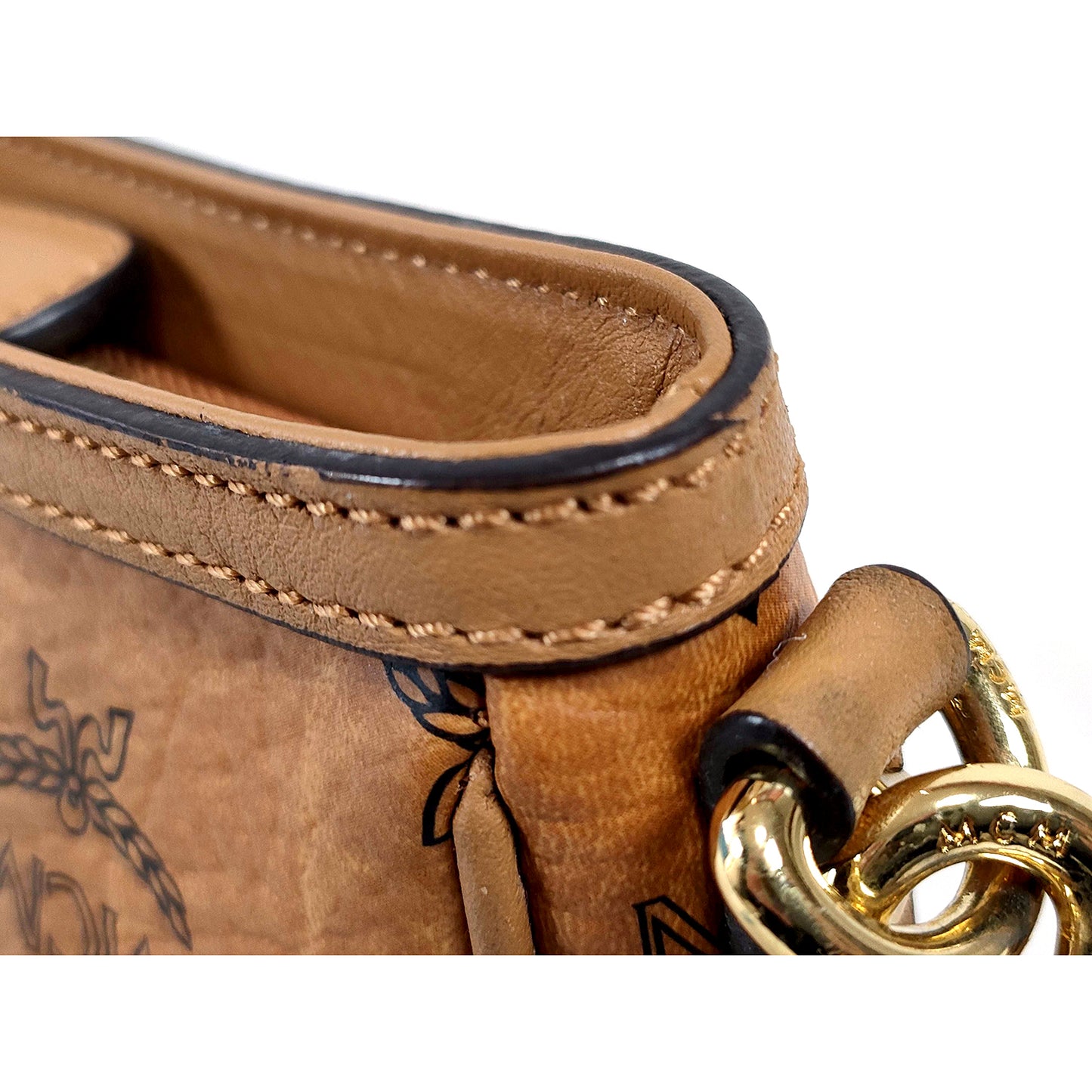 #1147 MCM Studded Baguette Bag in Cognac Visetos