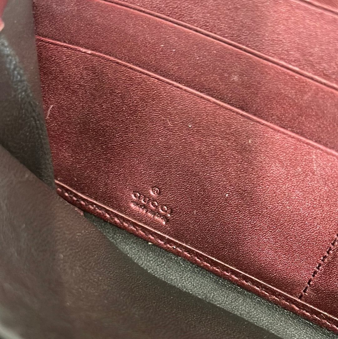 SOLD! Gucci GG Leather Zippy Wallet