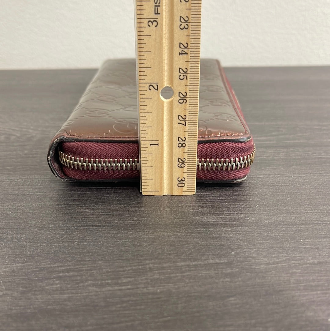 SOLD! Gucci GG Leather Zippy Wallet