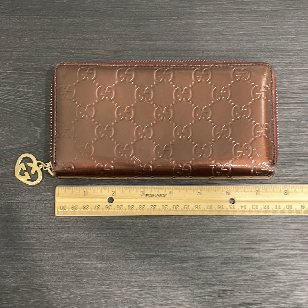 SOLD! Gucci GG Leather Zippy Wallet