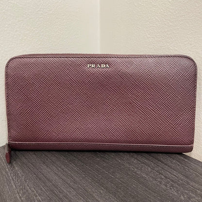 #128 PRADA Plum Leather Zippy Wallet