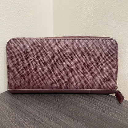 #128 PRADA Plum Leather Zippy Wallet